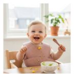 Imagen de Babero Kikkaboo Silicona Con Bolsillo Cierre Ajustable Liso Rosa 6 Meses En Adelante