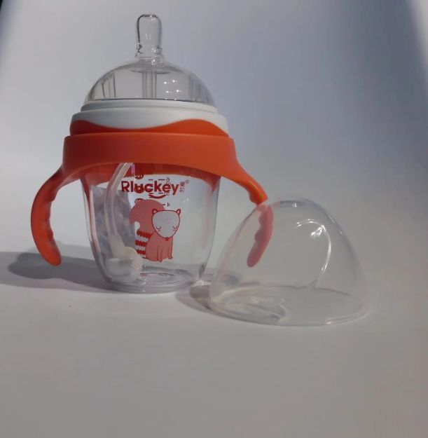 Imagen de Vaso Mamadera Con Asas Y Tetina Bebés Resiste El Calor 3m+ Coral Claro Liso